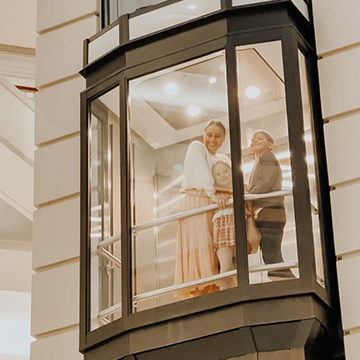 Family looking out from elevator
